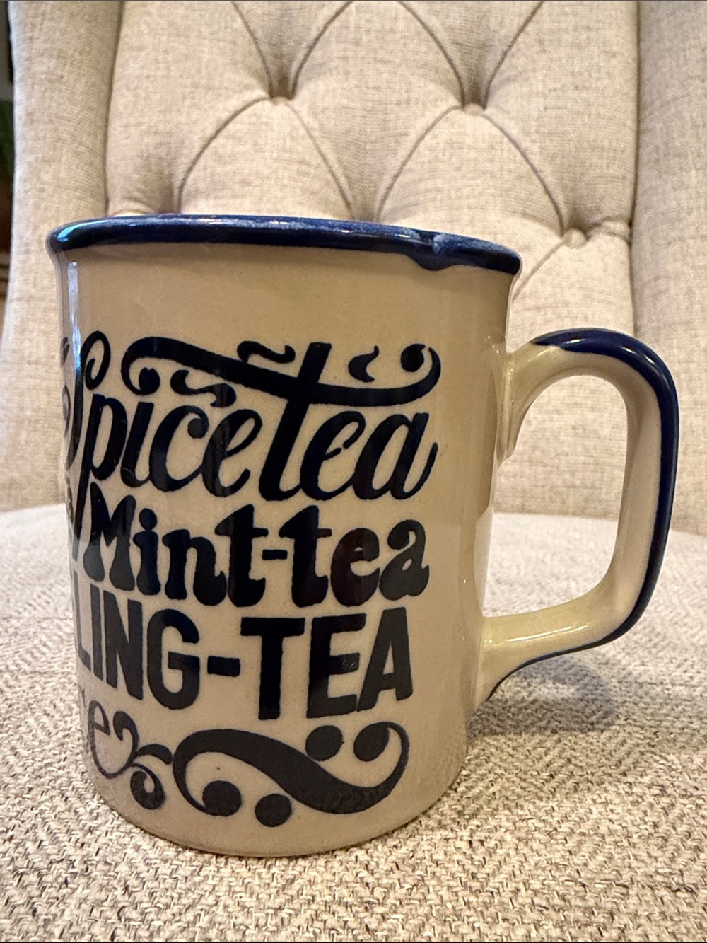 Cream Ceramic Tea Mug with Blue Accents and Script Text